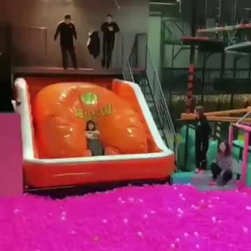 A Girl Diving Inside Balls