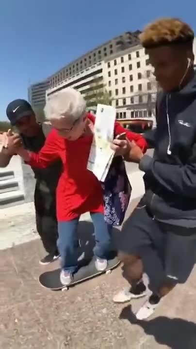Young Skaters Teaching An Old Lady