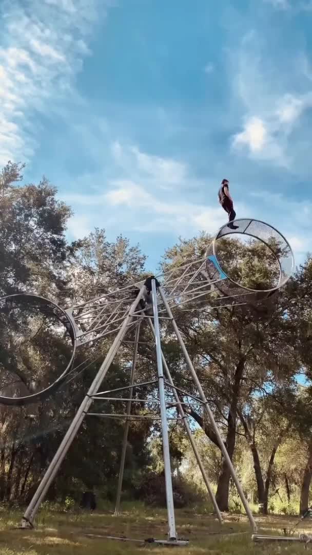Circus Performer Casually Walks on Wheel of Death