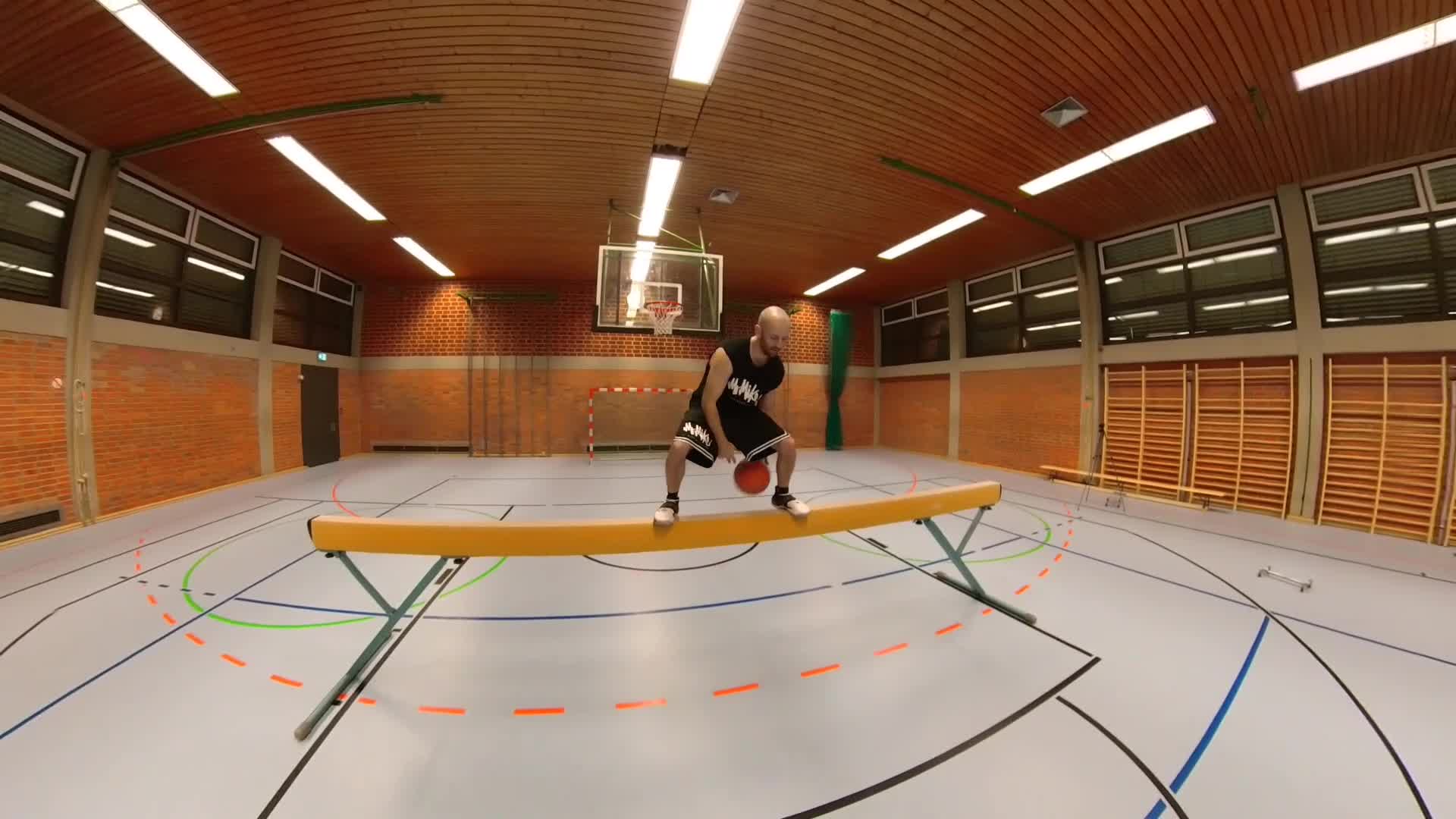Guy Smoothly Dribbles Basketball on Balancing Beam