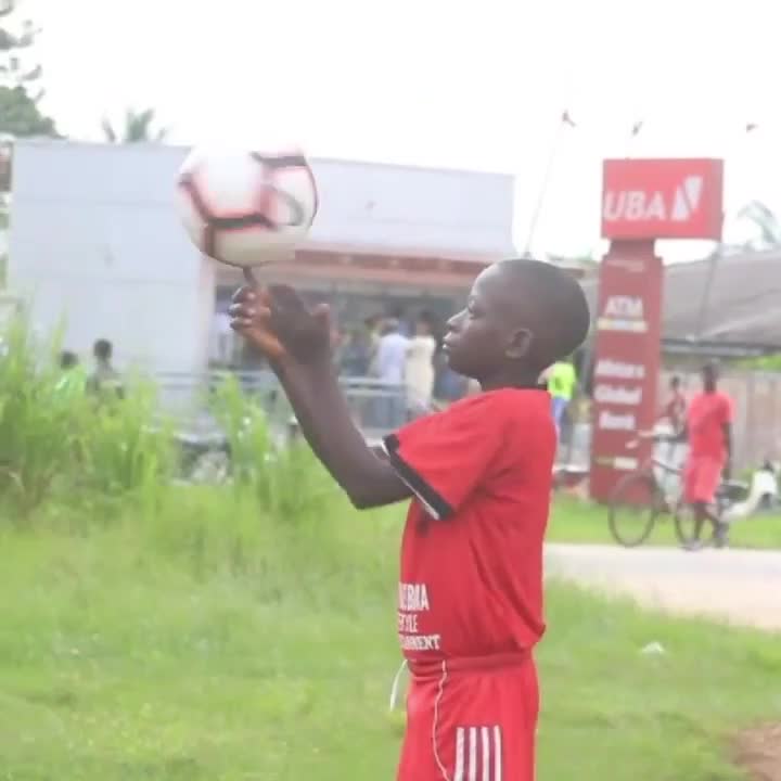 Kid Spins Soccer Ball Over His Finger