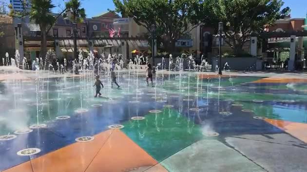 Kids Playing in Water Fountain Slow-motion