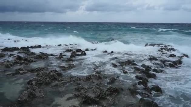 A Choppy Sea Crashing Onto Rocks