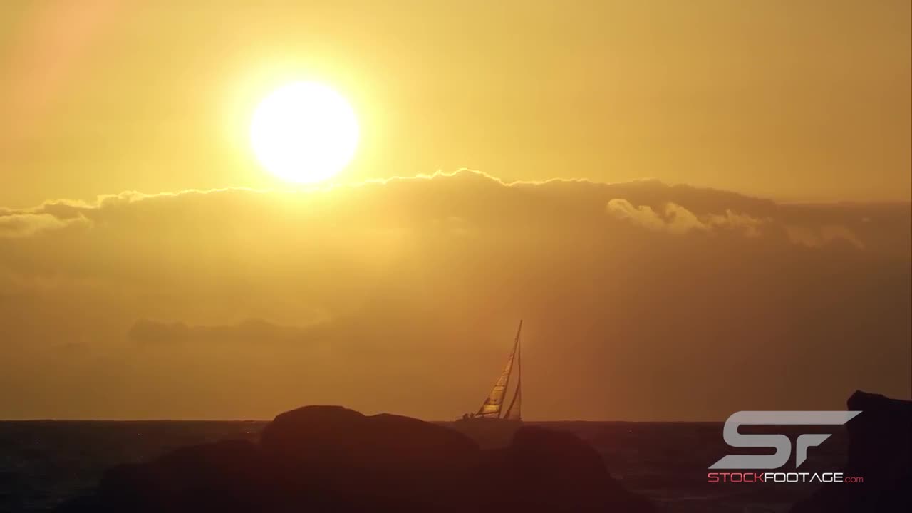 Static View of Sailboat on the Horizon at Sunset