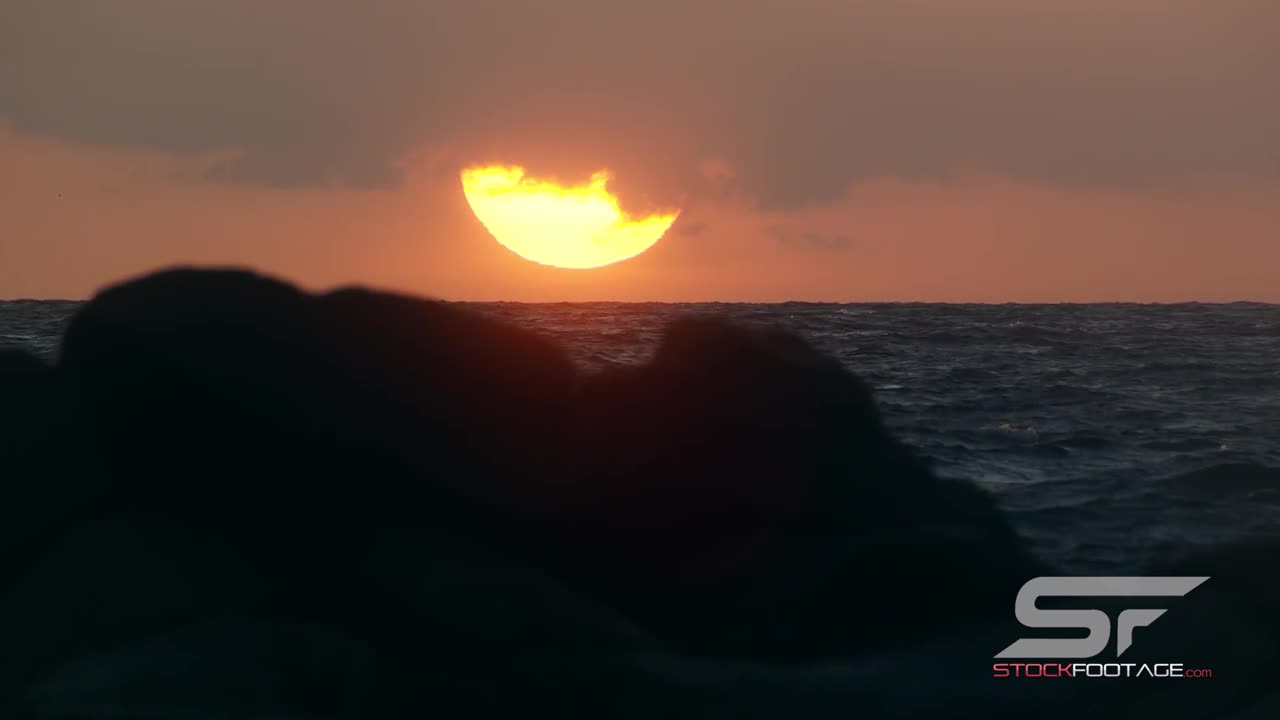 Slow Motion Shot of Sun Setting Over the Ocean